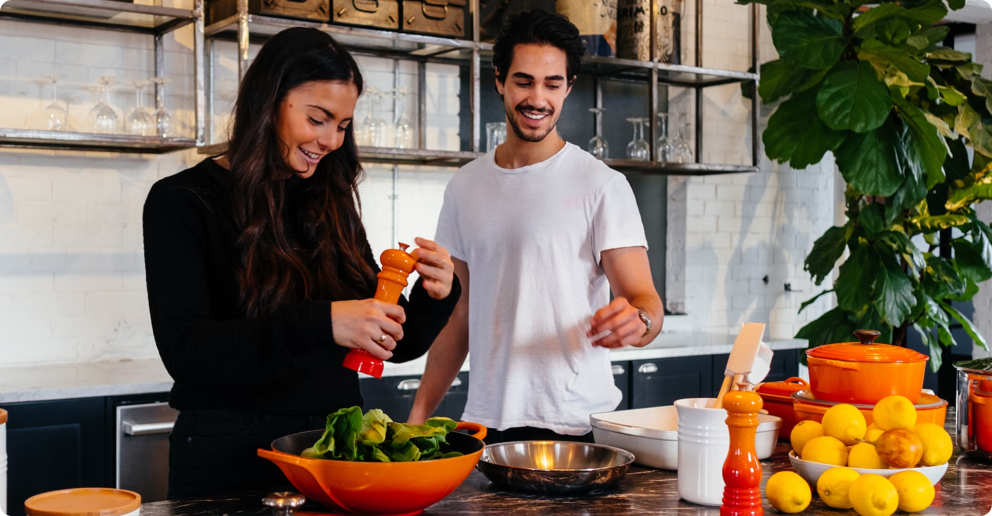 couple cooking together happily